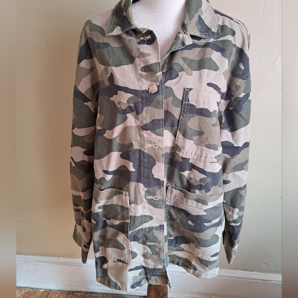 Divided camouflage pattern top.